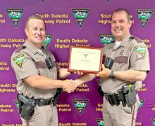 The South Dakota Highway Patrol has announced the appointment of Major Austin Schmitz (r) as its new Assistant Superintendent. Schmitz will now oversee the agency’s administrative operations. Major Schmitz brings 16 years of experience within the Highway Patrol to his new role. His tenure includes service as a police service dog handler and leadership in key operations. He has also been recognized for bravery, including an Act of Valor Award in 2020 for a rescue on Lake Sharpe.
