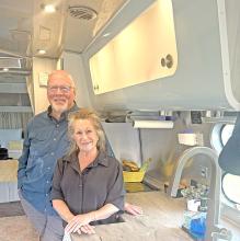 Dan and Jo Petty in the kitchen of their Airstream, Gracie.