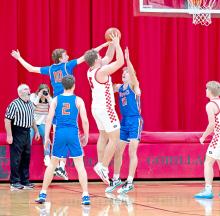 Rane Kenzy is surrounded by defenders as he attempts a shot against Jones County. (Photo by Calli Jo Photography)
