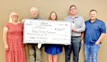 Laura Petersen, Bruce Finzen, and Rachelle Bloom (l to r) are shown here accepting a grant from Tony Timanus and Alex Hamilton of the First Fidelity Bank &amp; Gregory Community Foundation for $2,000 in matching funds for the city’s pickleball/tennis courts. With this, the court will be fully funded without requiring any financing from the city. Watch for further news on this as the installation is scheduled to take place later this summer and volunteer help will be needed to put everything in place.