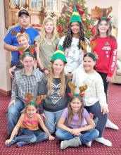 On Sunday, December 8, 2024, the Tripp County Border Bumper 4-H Club, led by Melissa Wonnenberg, shared activities, including a deer hunt, crafts, music and snacks with the residents of Silver Threads Assisted Living in Gregory. Club members included back row, l to r: Izaac Hamiel, Milo Serr, Zona Serr, Cierra Graesser, and Ellika Hamiel. Middle row, l to r: Liz Wonnenberg, Lydia Wonnenberg, and Lashya Graesser. Front row, l to r: Nova Serr and Cora Serr.