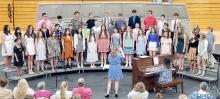 The voices of the jr. high choir blended well in five different songs they performed for the program.