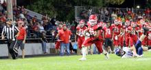 Trey Murray breaks a tackle on his way to the goal line in Friday night’s win over Irene/Wakonda. Murray scored 14 points for the Gorillas in the game. (Photo by Alexis Kortan)