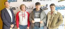 Q107.3 Quiz Bowl Champions....l to r: Nathan Fortuna, Eli Barreto, and Trey Murray, won the Q107.3 Quiz Bowl finals in Mitchell, on January 6, 2023. Operations manager at KORN, Clint Greenway, far left, presented the winners with a check in the amount of $1,000.00 to be used for the Gregory Public School.