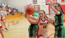 ReNae Prokopec fights through Miller players for the ball.