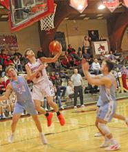 Jordan Songer goes up for two in Gregory’s win against Bon Homme on Friday. Daniel Mitchell led the team in points and rebounds for a double-double in the game.
