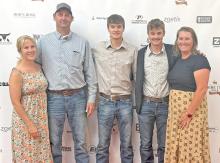 Tyler Kenzy, second from the right, was announced as the winner of the Fed Cattle Challenge. He is shown here with his family, l to r; mother Shelly Kenzy, father George Kenzy, brother Nick Kenzy, and Gregory County FFA advisor Mollie Andrews.