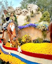 Mt. Rushmore and a bronc rider were featured on the float. (Photo taken from Travel South Dakota’s Facebook page.)