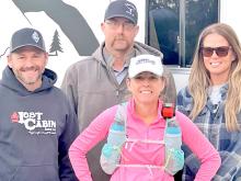 Melissa had a crew of brother Jeremy, husband Chris, and friend Beth Eliason, shown behind her, l to r, who helped her in the race. (Submitted photo)