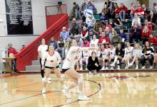 Allison Stevicks executes a successful serve reception as Raylynn Dehning keeps an eye on the ball.
