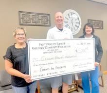First Fidelity Bank and the Gregory Community Foundation gave a grant of $5,000 to the Gregory Baseball Association to help with the costs of building a new crow’s nest at the baseball field, where the teeners/legion teams play. Pictured l to r: Terri, Bartling, member of Gregory Community Foundation, Jeff Determan, representing the Gregory Baseball Association, and Sue Hogue, member of the Gregory Community Foundation.