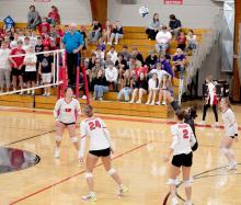 The Spikers keep an eye on the ball, getting ready to send it back over the net in last Tuesday’s match against Winner. (Photo by Calli Jo Photography)