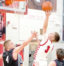 During the hard fought battle against Platte-Geddes, Lincoln Juracek led the charge with 17 points. (Photo by Melissa Bearshield)