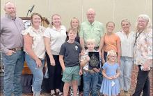 Dr. Gary Straight’s family surprised him as he received the South Dakota Veterinary Medical Association’s Distinguished Service Award at their annual banquet on August 15, 2024. Pictured are back row, l to r: son Jim and his wife Halie, daughter Sarah, granddaughter Gracelyn, Gary, granddaughter Henlee, daughter-in-law Jill, and Marile. Front row, l to r: grandsons Fletcher and Owen, and granddaughter Eliza.