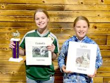 At the SDRBA show in Rapid City, Elizabeth, right, was top youth point earner and first overall in the Junior Royalty contest, which included her show records, an essay about her accomplishments and goals, a general test, breed identification, and a showmanship contest. Lydia, left, was first overall in the royalty contest for beginners.