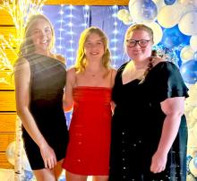 Seniors, l to r: Asia VanDerWerff, Dani Timanus, and Riki Bruns stand together after organizing the IOOF Winter Formal in December. The event raised $800, which the trio donated to local causes.
