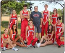 The 2021 Gorilla Cross Country Team includes, front row, l to r: Asia VanDerWerff, Sierra Rencountre, Ryler Stevicks, Emma Thomas, and Pierce Stukel. Back row, l to r: Emily Grim, Carson Klundt, Coach Lonnie Klundt, Luke Sinclair, and Kodi Timanus.