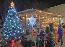 Frigid temperatures Friday night failed to deter holiday revelers from enjoying the tree lighting and visiting Santa.