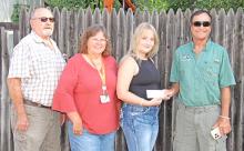 Each year Dallas Cares awards a $1,000 scholarship to a high school senior for volunteer work performed. Dallas Cares representatives Jack Jacobsen, Brenda Lane, and Jack Gunvordahl (far right) presented the scholarship to this year’s recipient, Alyssa Galbraith (second from right).