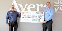 BankWest’s Branch Manager David Kotrba presents a check to Avera Gregory’s CEO Anthony Timanus.