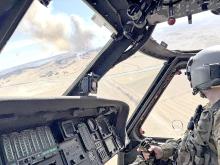 National Guard helicopter crews assisted local firefighters in battling two new wildfires that broke out March 26 in Grant County, NE, near the communities of Bingham, Ashby, and Hyannis. The helicopters are equipped with Bambi buckets, which allow the helicopter crews to drop water onto the fires from the air. (Photo from the Nebraska National Guard’s Facebook page)