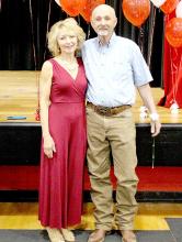 John Hansen is joined by his wife Cheri at the Gregory High School graduation, where he was honored for his 50 years with the school.
