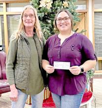 Tamara Atteberry accepted a check on behalf of the Burke Pink Ladies and the Community Christmas tree.