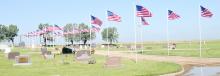 The St. Joseph Catholic Cemetery flew flags in observance of Memorial Day on Monday, May 29, 2023. The weather was warm following a thunderstorm the night before that brought rain accumulations ranging from .90 to two inches in the area.
