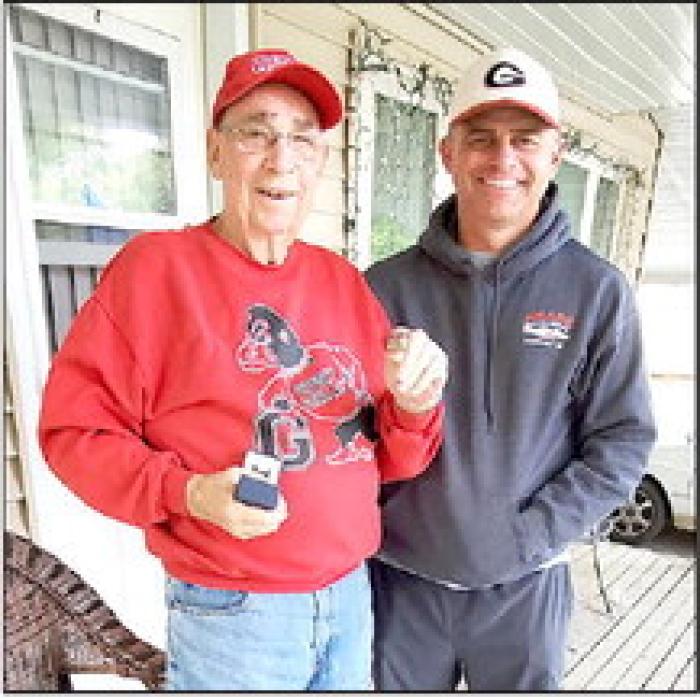 Gorilla Head Football Coach Mike Murray presented Dewey Allum with a championship ring to commemorate his membership on the 1958 state 11A championship team.