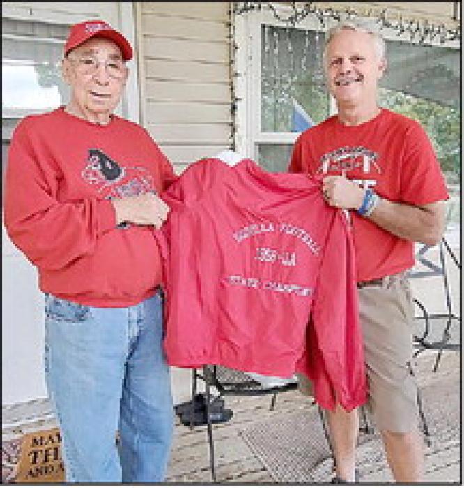 Allum also received a jacket like the ones given to state champs in all sports these days. Scott Anshutz is shown here giving the jacket to Allum.