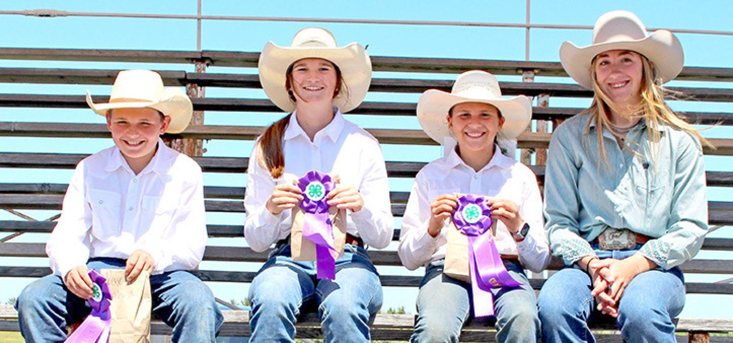 All around winners were l to r: Paxton Coburn, Morgan Peck, and McKinley Peppel. Hailey (right) &amp; Hayden Haiar (not pictured) awarded buckles to the all-around recipients in memory of their father, Cory Haiar.
