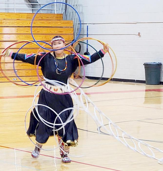 Toward the end of her hoop dance, Chief Eagle used 22 hoops to make herself into a bird with a long tail.