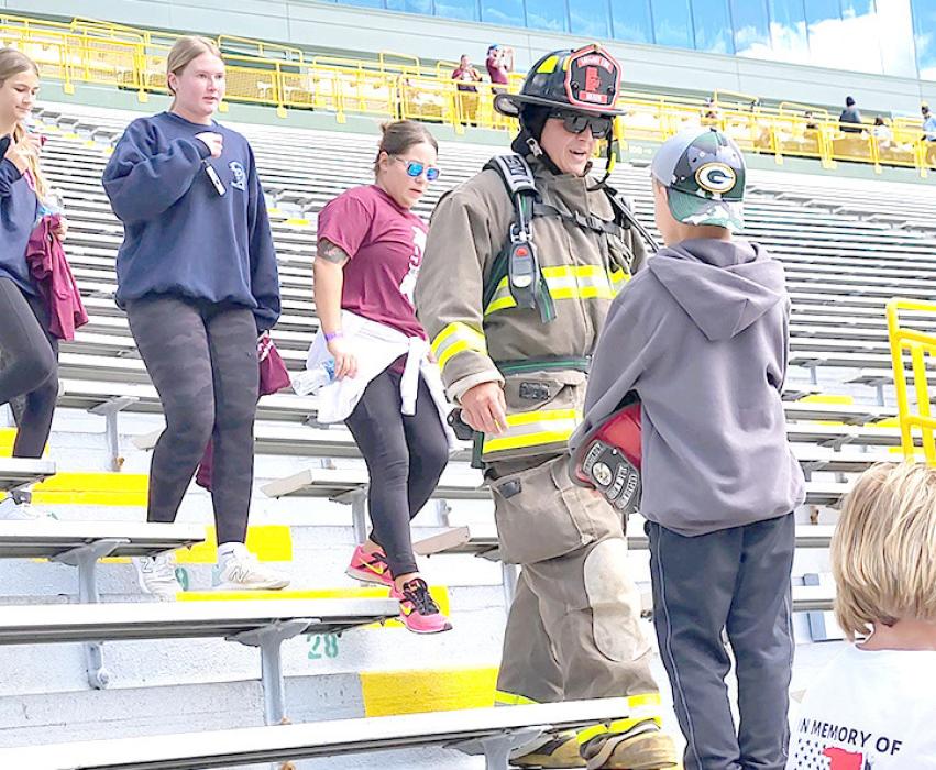 Mark Braun completed the 911 Memorial Stair Climb in full gear at Lambo Field in Green Bay.