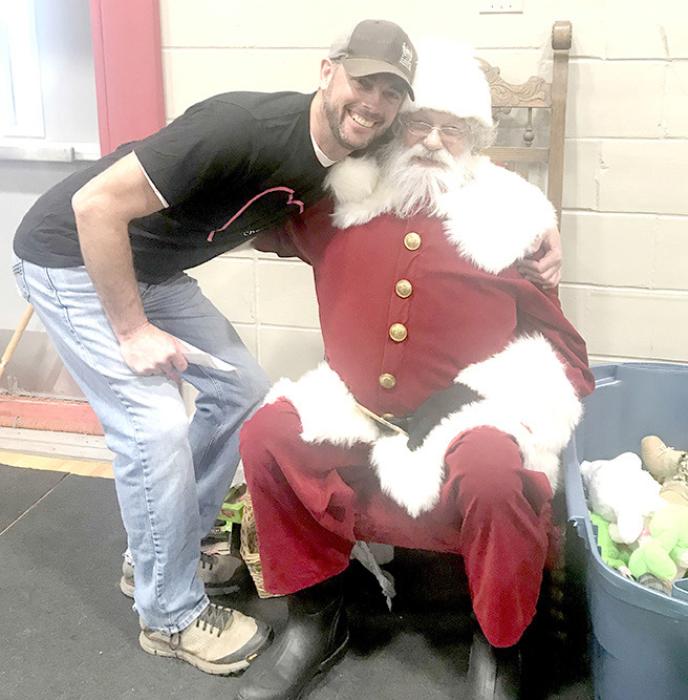 Gregory Police Chief makes sure Santa knows all the laws about breaking and entering prior to his big night of delivering toys.
