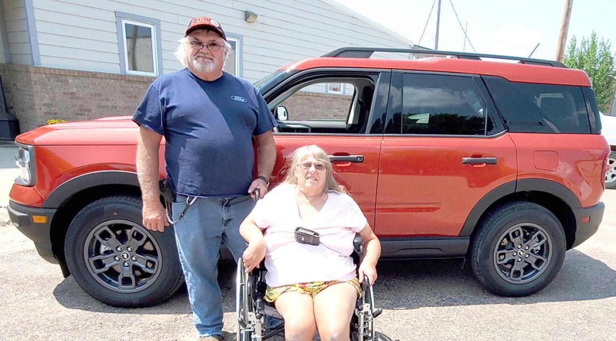 Winner of the Bronco fundraiser for the pool John Vosika and his wife Sherri are pretty happy with their prize, although John thinks it will take some time to figure out all the different features in the new vehicle.