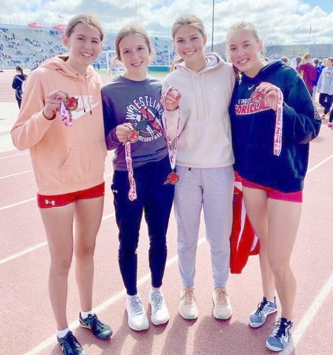 Regan Graesser, Adelyn Veskrna, Dani VanDerWerff, Asia VanDerWerff, placed fifth in the SMR 1600 meter relay at Howard Wood.