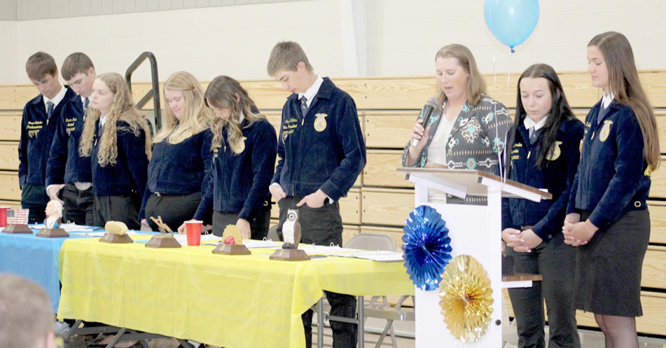 2022-2023 officers performing opening ceremonies for banquet were l to r: Breven Bolander, parlimentarian; Carson Peck, sentinel; Kaydence Klein, reporter; Dori Bruns, treasurer; Avery Zeisler, secretary; Cody Williams, VP; Mrs. Mollie Andrews, advisor; Savannah Schrader, historian; and Taylor Even, president.