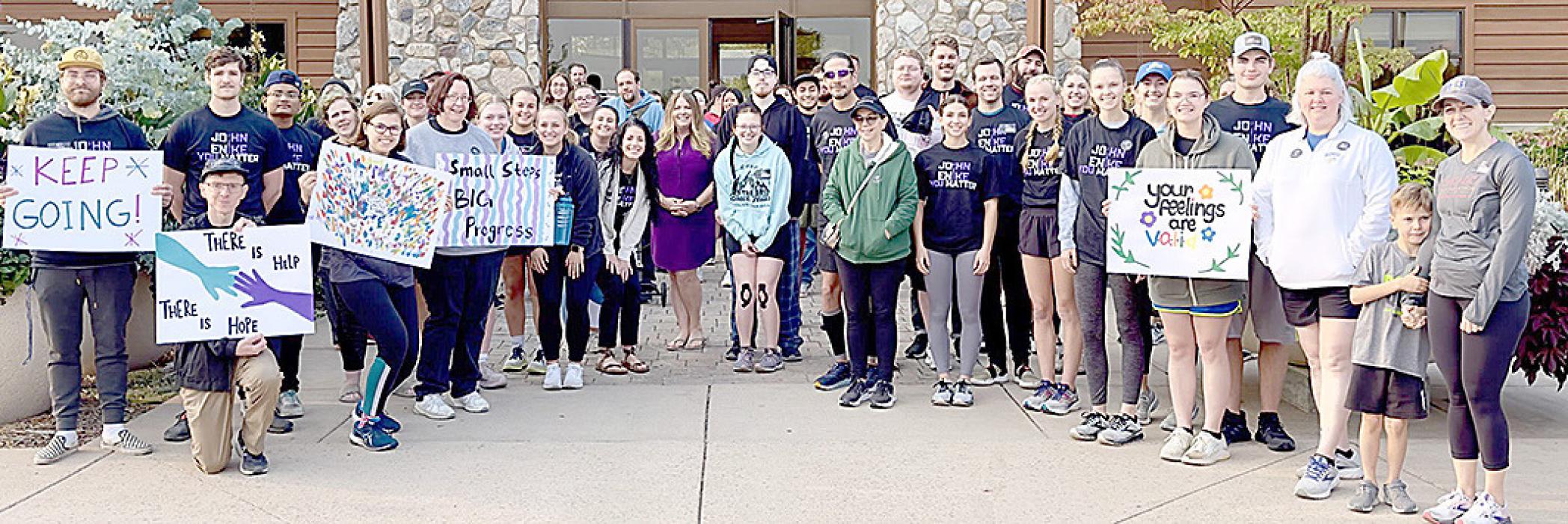 Everyone who attended the memorial 5K was invited to stamp their thumbprint “leaf” on the tree in either purple or teal, colors that signify suicide awareness. (Photo provided by SDSU Wellness Center)