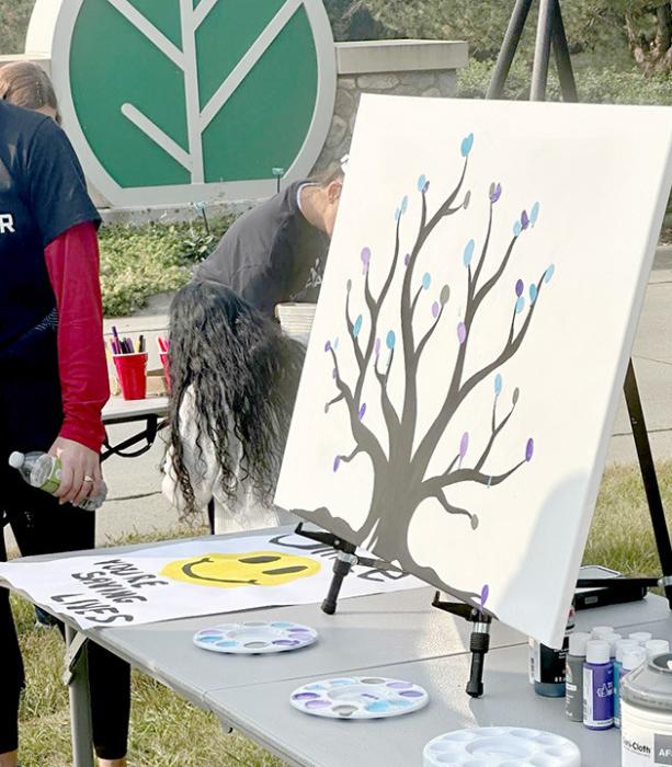 Many of John’s family and friends, as well as others who support suicide awareness and prevention, attended the walk. Several gathered for a photo afterward. (Photo provided by SDSU Wellness Center)