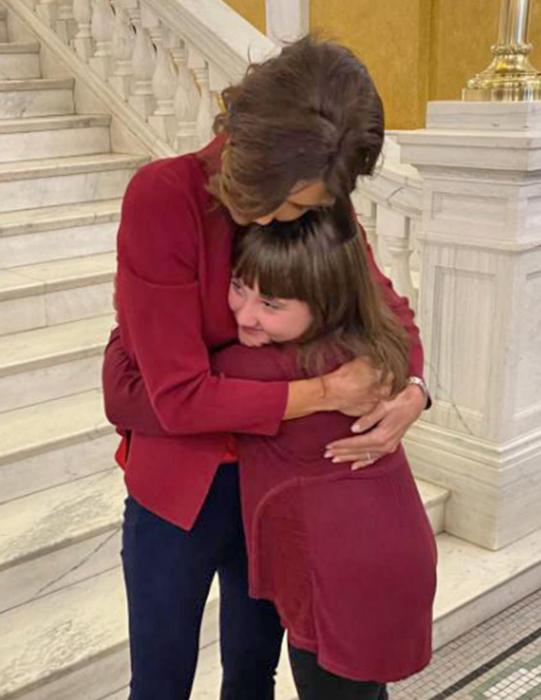 Governor Noem hugs Jaelyn after the young girl thanked her for all she does for the state.