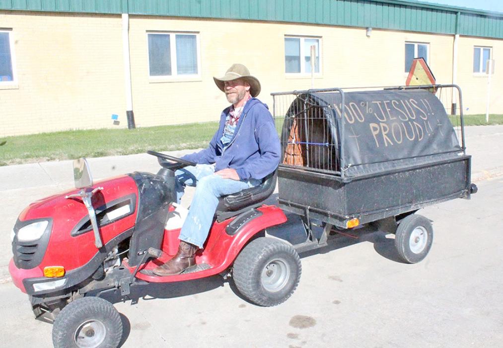 Brady Knight will be driving this tractor and pulling this trailer to Texas, there he will distribute donated items to the homeless. (Dan Bechtold/Winner Advocate Photo)