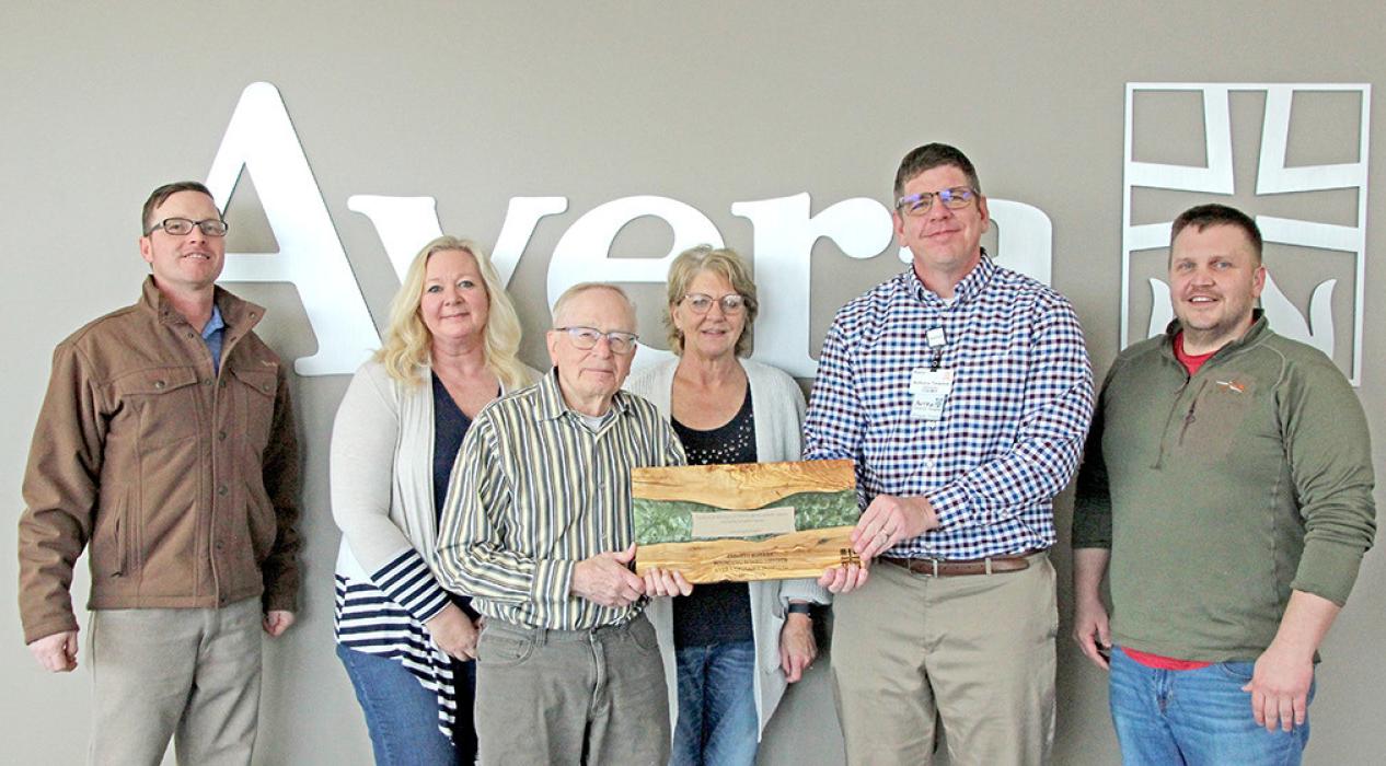 Emmett Kotrba was presented a plaque for his years of service on the hospital boards by Avera board members. (Photo by Shelby Jones)
