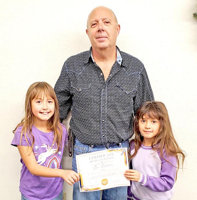 Lee Lubbers gives his daughters Zyleigh, left, and Zoe, right, credit for helping him win the 2024 National Wheat Foundation’s National Wheat Yield Contest for South Dakota.