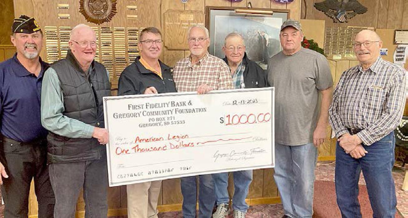 Sam Flakus, third from left, representing the FFB and Gregory Community Foundation, presented a check for $1,000.00 to members of the Gregory American Legion. They are l to r: Greg Smith, Bob Fenenga, John Knight, Gerald Gergen, Joe Klein, and Richard Shaffer.