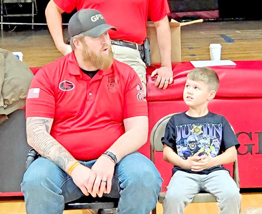 Police Deputy Jeremy Atkin discusses what would happen with a smaller passenger in the front seat (Jaxon Bearshield) if an airbag deploys.