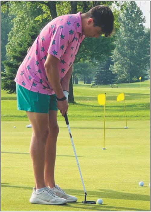 Luke is shown here with Assistant Golf Coach Brittany Reber and Head Golf Coach Wilson Santiago. Below, Luke practices his putting skills before beginning a day of competition. (Submitted photos)