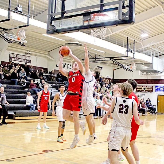 Landon Keiser goes up against a Black Panther defender in last Tuesday’s game against Platte-Geddes. (Photo by Maya Hull)