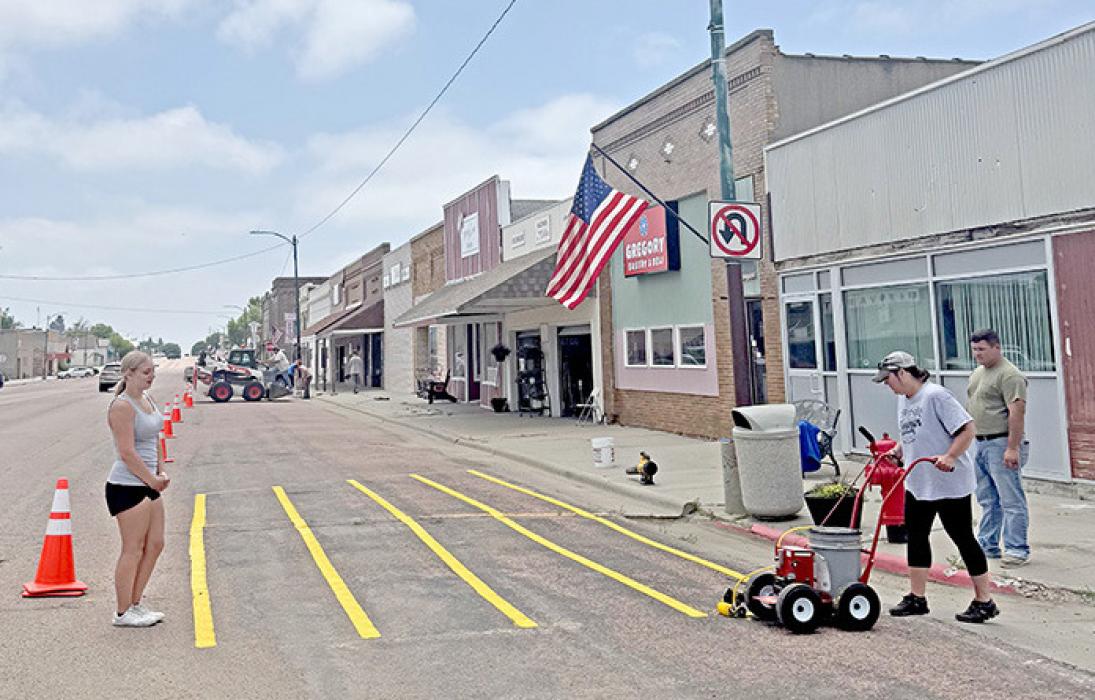 Some of the lifeguards stepped up to work on painting yellow lines along main street. The public works department has plenty of tasks for the lifeguards since the pool is not open at this time.