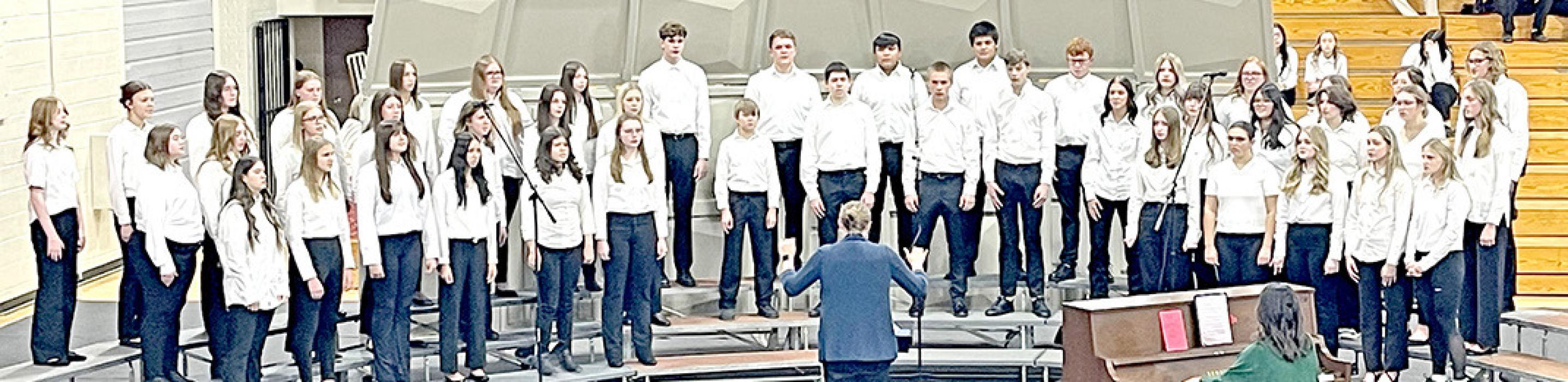 Jingle Bells, Somewhere in My Memory, and Amid the Falling Snow were performed by the high school chorus. (Photo by Sara Anderson)