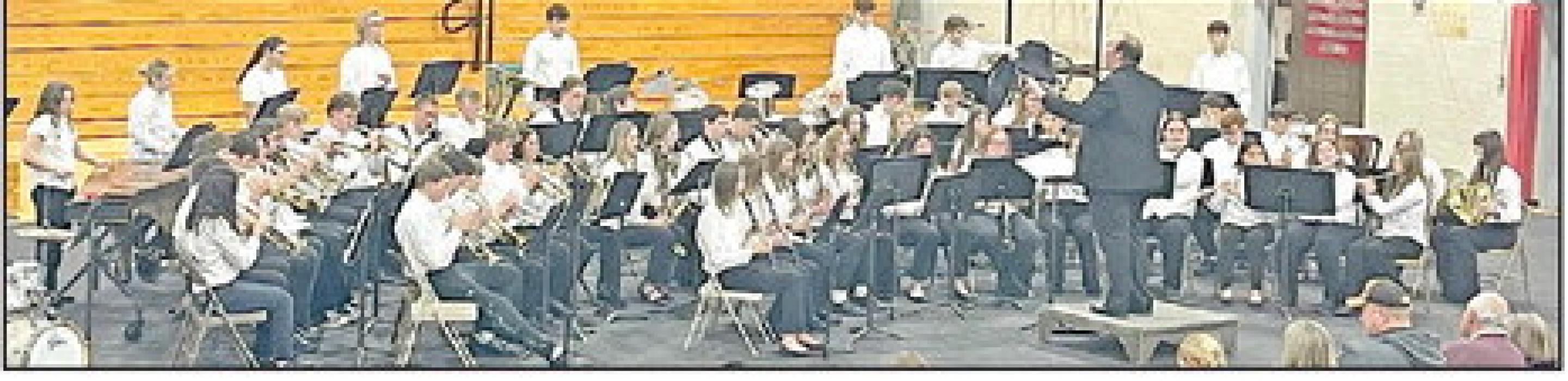 The high school band performed Christmas Troika and the five-movement Christmas Village before the program culmination of all the 6th-12th grade music students joined together for Holiday Favorites by Emerson and Lavender. (Photo by Sara Anderson)